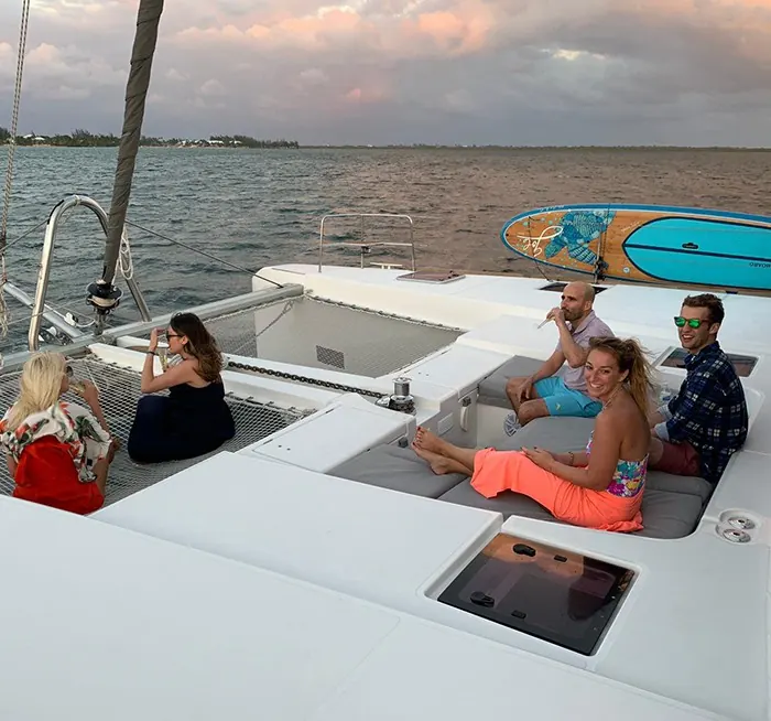 Guests on the foredeck during a Bamboozled sunset cruise